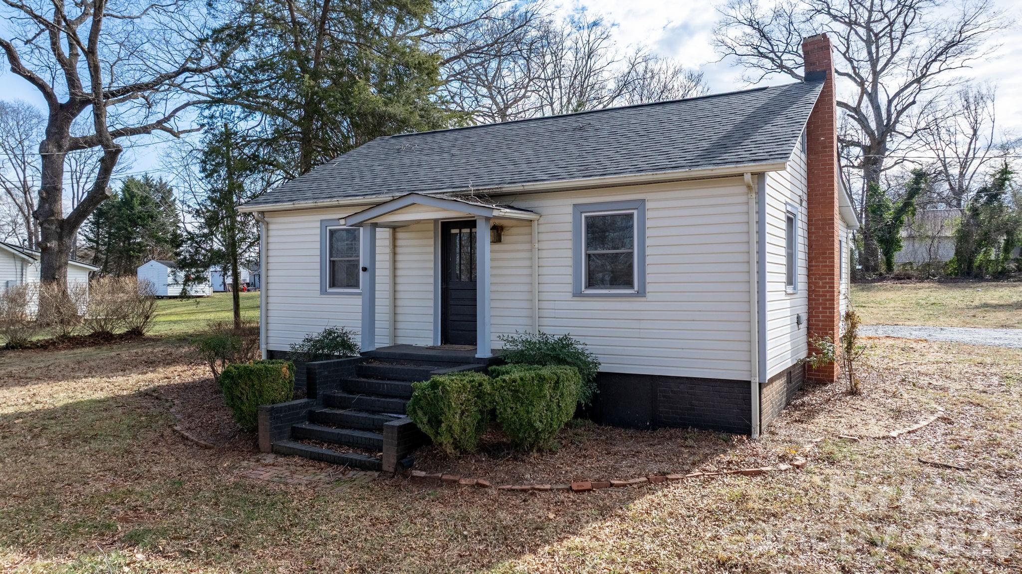 116 Barnes Lane Stony Point, NC 28678 - Photo 25 of 40 a view of a house with a yard and a large tree