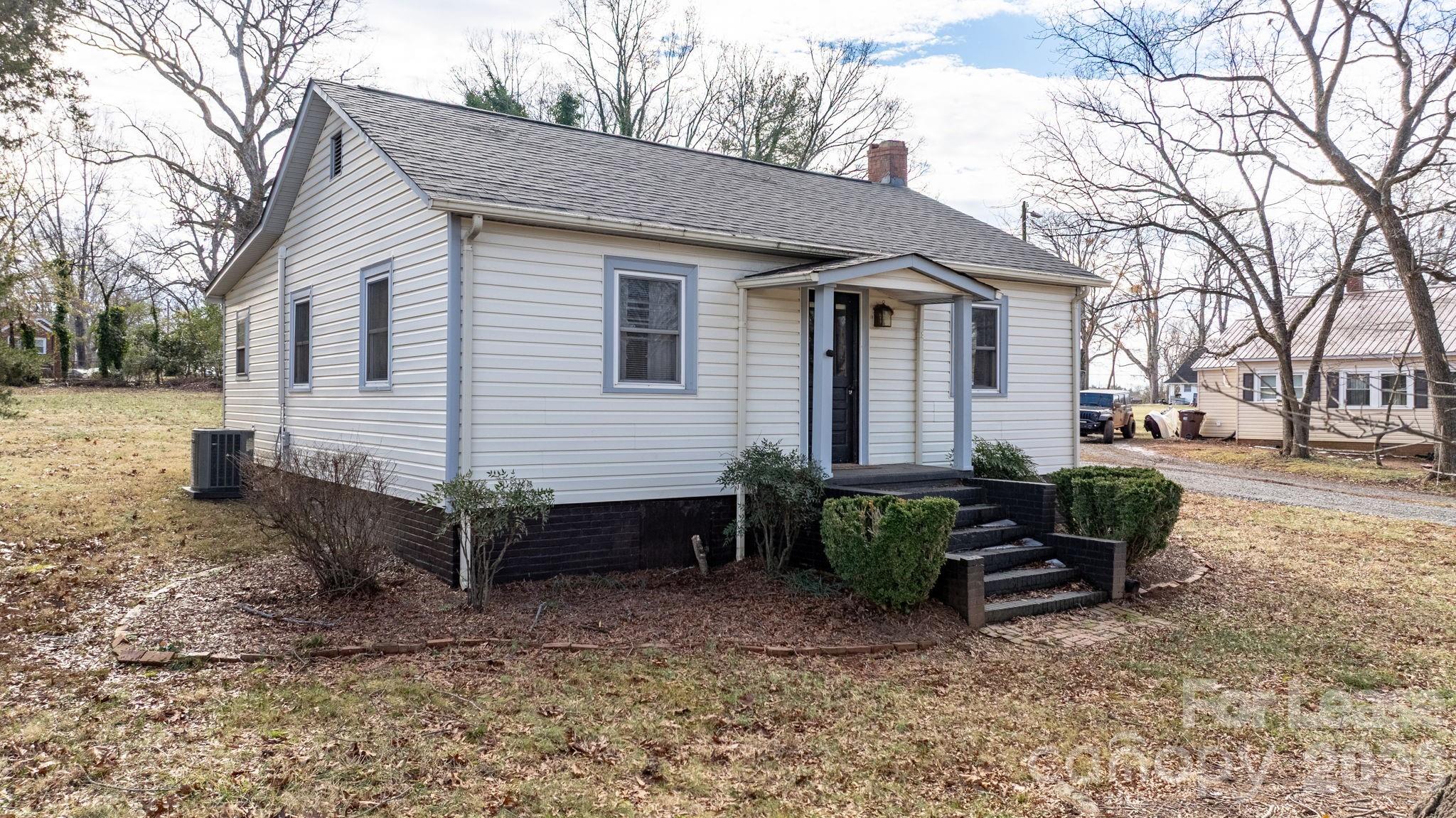 116 Barnes Lane Stony Point, NC 28678 - Photo 28 of 40 a view of a house with backyard and sitting area