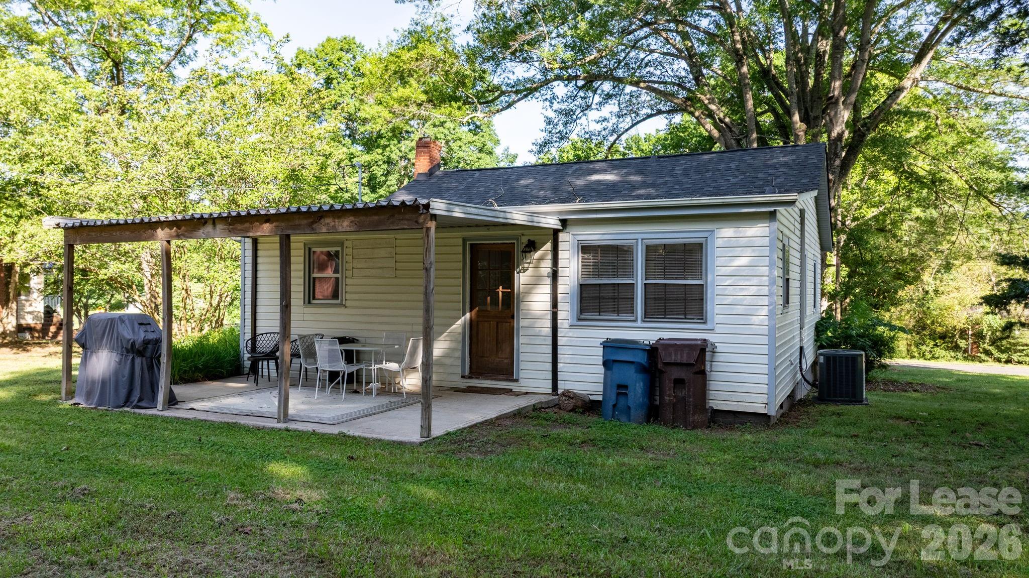 116 Barnes Lane Stony Point, NC 28678 - Photo 6 of 40 a backyard of a house with seating space