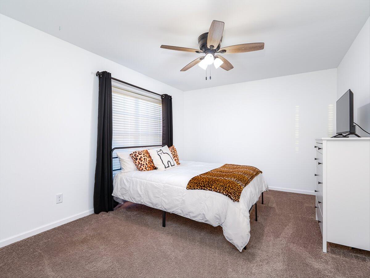 10377 Nevada Place Crown Point, IN 46307 - Photo 15 of 21 a bedroom with a bed and a chandelier