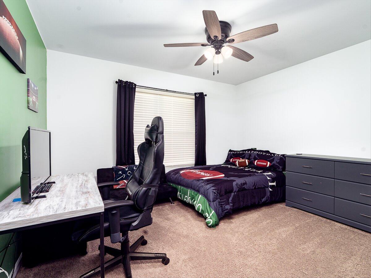 10377 Nevada Place Crown Point, IN 46307 - Photo 17 of 21 a bedroom with bed and a chandelier