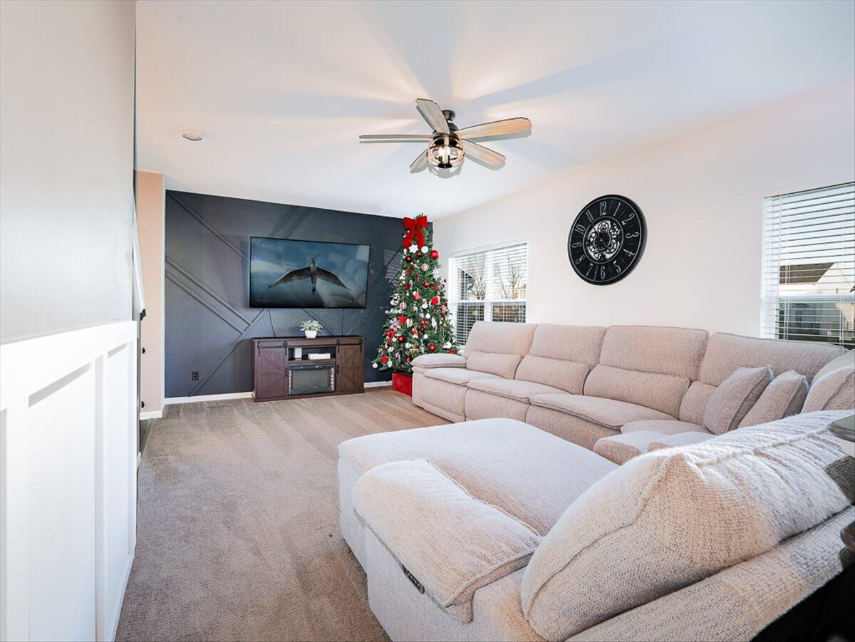 10377 Nevada Place Crown Point, IN 46307 - Photo 4 of 21 a living room with furniture and a flat screen tv