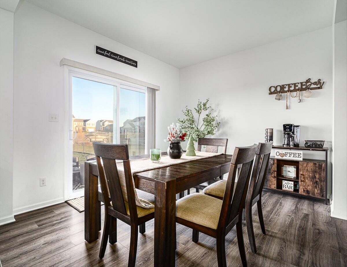 10377 Nevada Place Crown Point, IN 46307 - Photo 6 of 21 a dining room with furniture and wooden floor