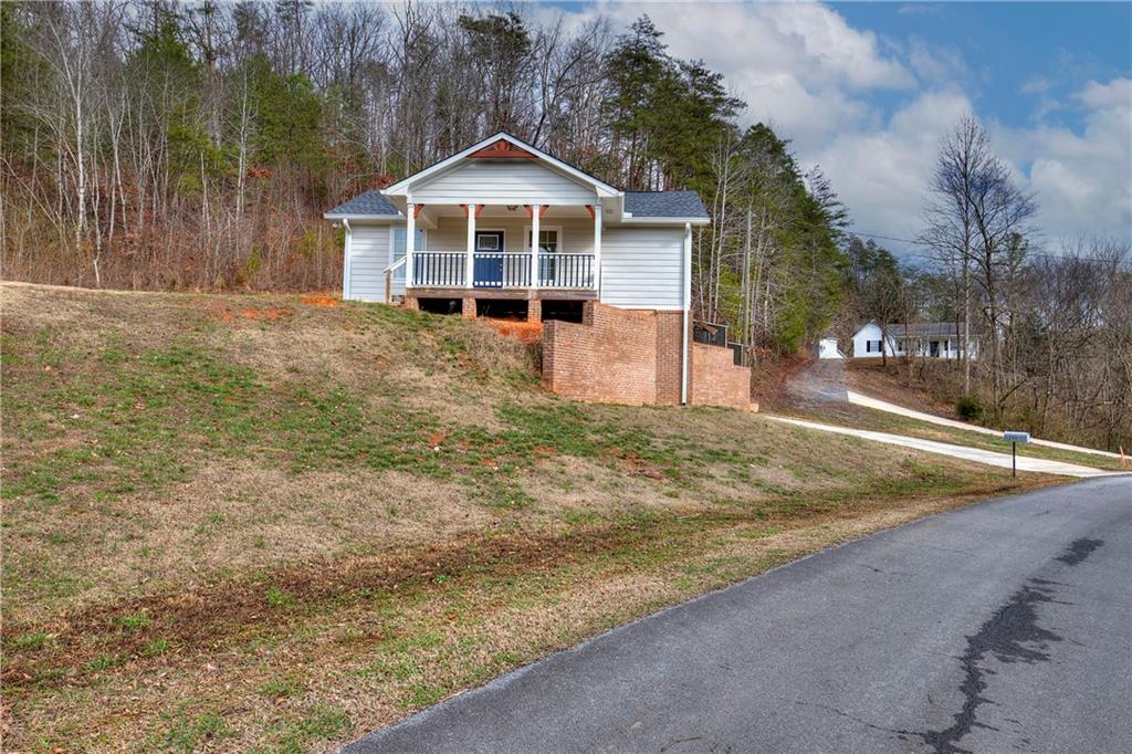 260 Irwin Mill Road Southeast Fairmount, GA 30139 - Photo 1 of 1 a front view of a house with a yard