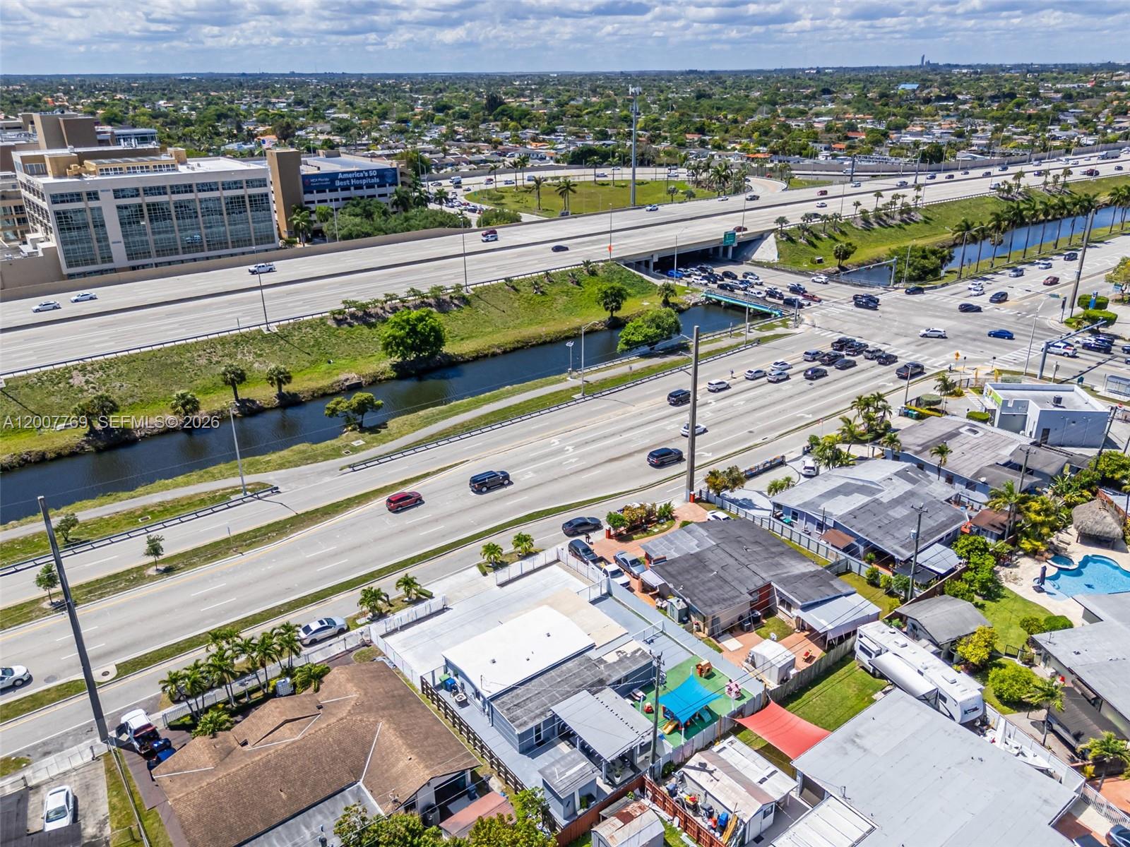 4041 Southwest 117th Avenue Miami, FL 33175 - Photo 11 of 47 an aerial view of a city with a lake