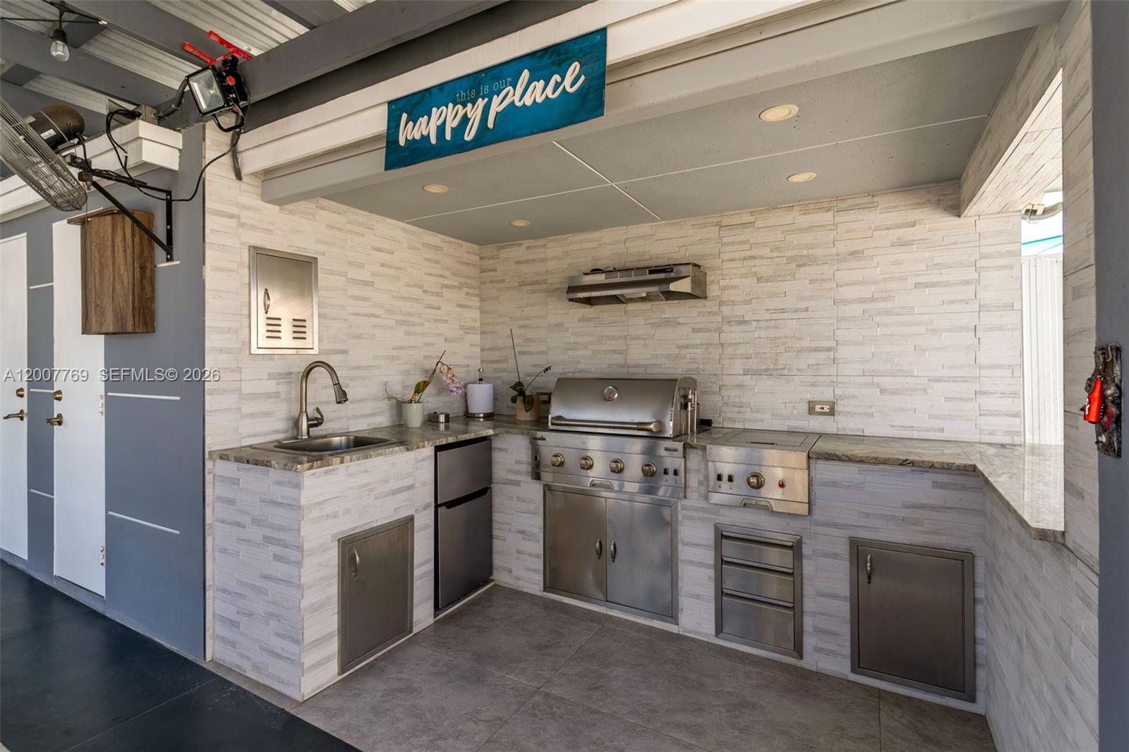 4041 Southwest 117th Avenue Miami, FL 33175 - Photo 17 of 47 a kitchen with stainless steel appliances granite countertop a stove and a refrigerator