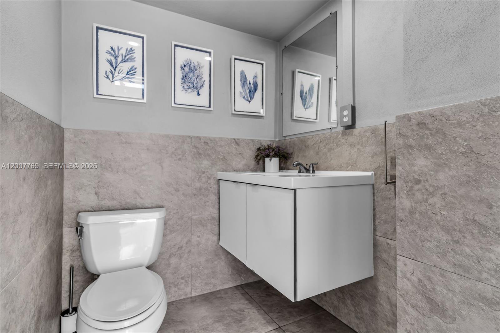 4041 Southwest 117th Avenue Miami, FL 33175 - Photo 20 of 47 a bathroom with a toilet sink and mirror