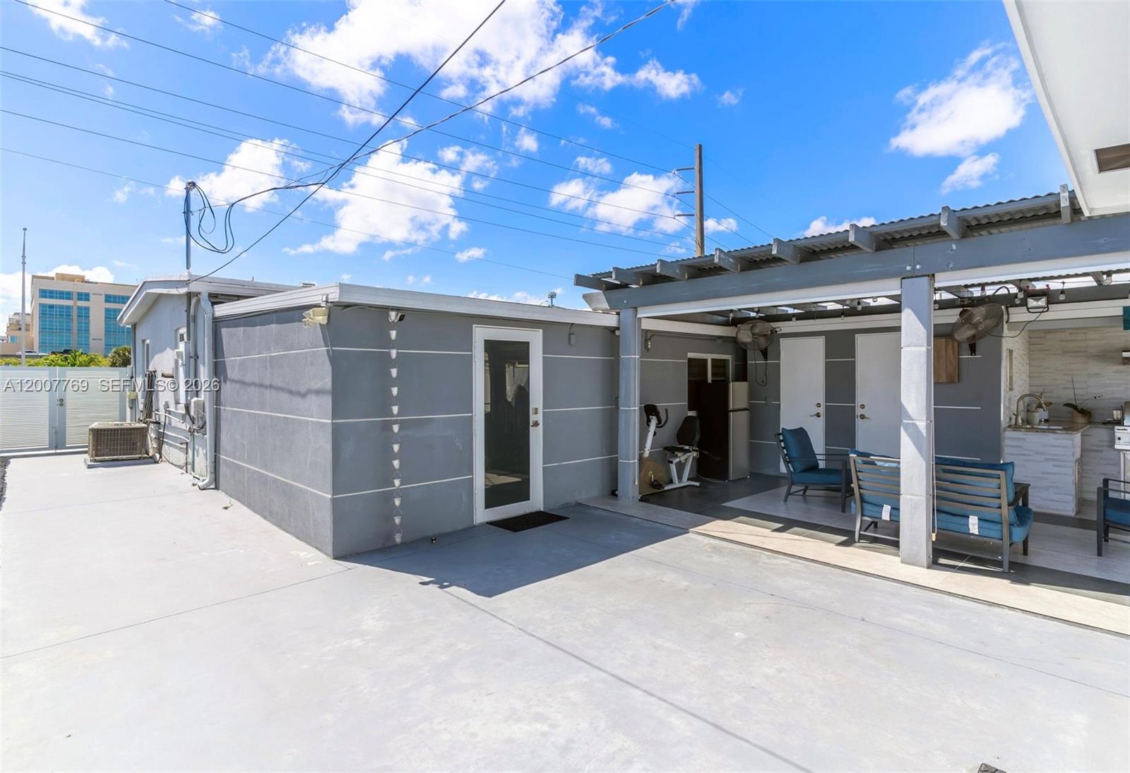 4041 Southwest 117th Avenue Miami, FL 33175 - Photo 23 of 47 a view of a house with a patio