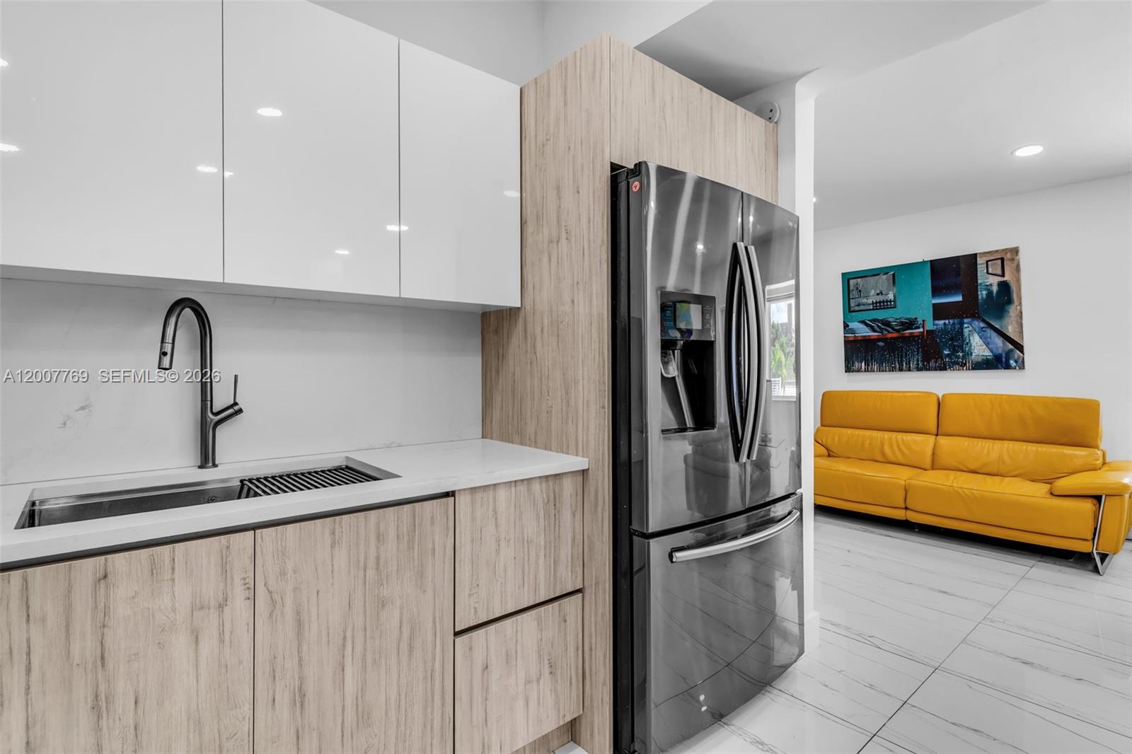 4041 Southwest 117th Avenue Miami, FL 33175 - Photo 27 of 47 a kitchen with stainless steel appliances granite countertop a refrigerator a sink a stove and a refrigerator