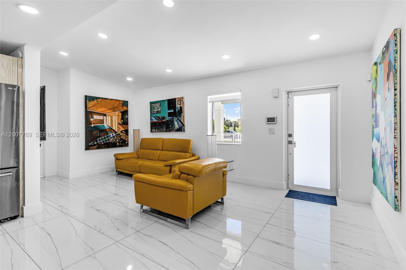 4041 Southwest 117th Avenue Miami, FL 33175 - Photo 28 of 47 a living room with furniture and a flat screen tv