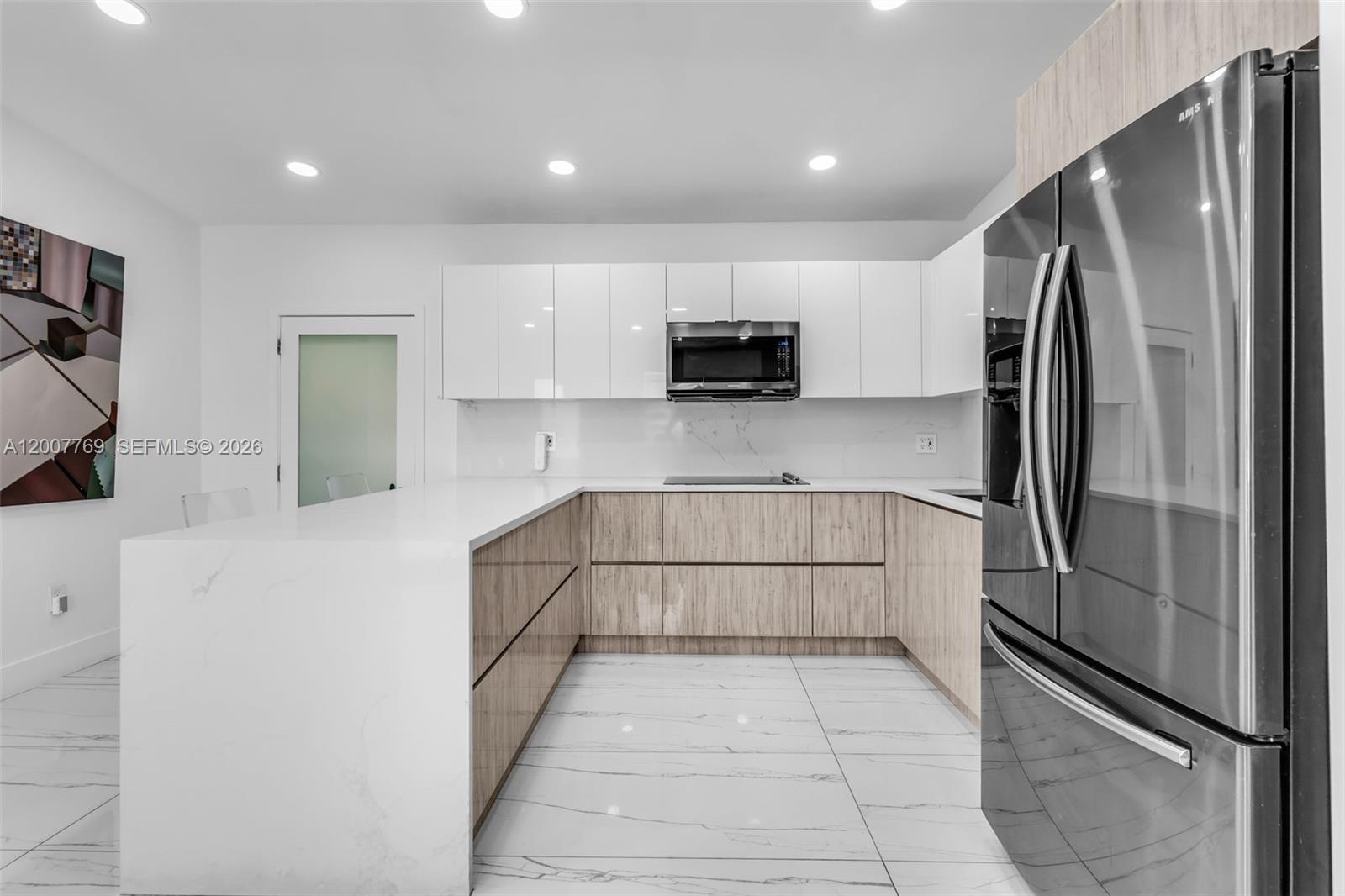 4041 Southwest 117th Avenue Miami, FL 33175 - Photo 30 of 47 a kitchen with stainless steel appliances granite countertop a refrigerator and a stove top oven