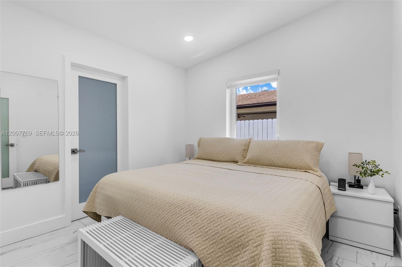 4041 Southwest 117th Avenue Miami, FL 33175 - Photo 32 of 47 a bedroom with a bed and a window