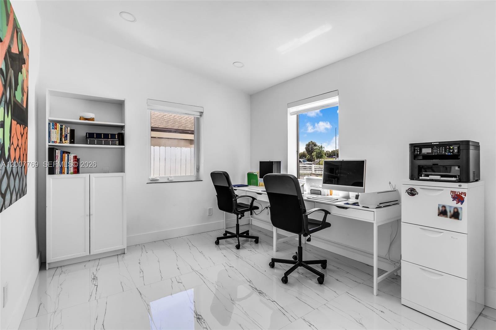4041 Southwest 117th Avenue Miami, FL 33175 - Photo 35 of 47 a view of a workspace with furniture and a window