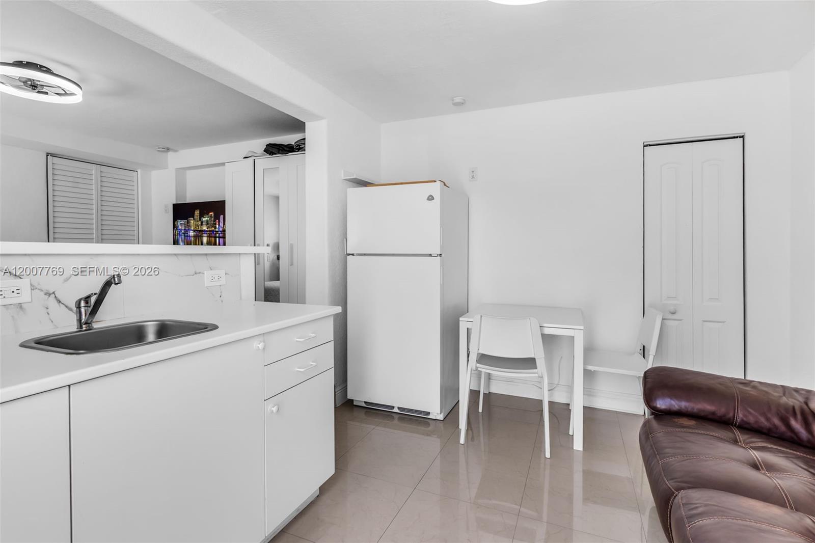 4041 Southwest 117th Avenue Miami, FL 33175 - Photo 41 of 47 a kitchen with a refrigerator and a sink