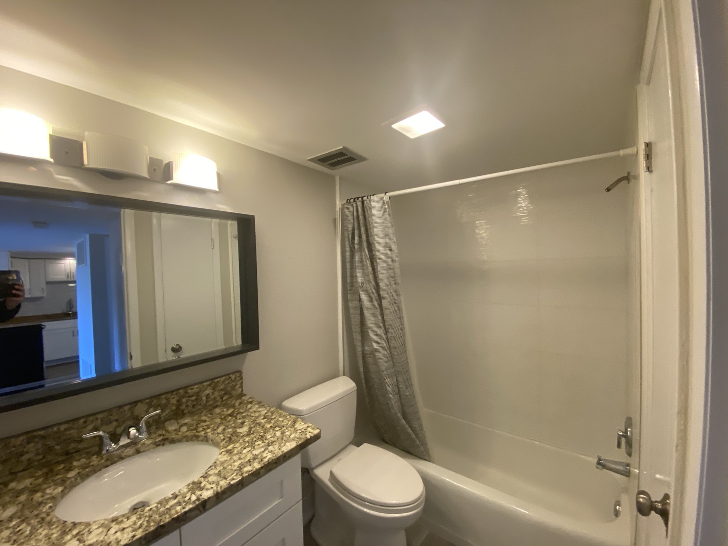 127 North Wolf Road, Unit 56A Wheeling, IL 60090 - Photo 7 of 13 a bathroom with a granite countertop sink toilet and shower