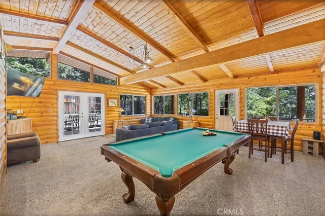 a bathroom with a granite countertop toilet sink and mirror