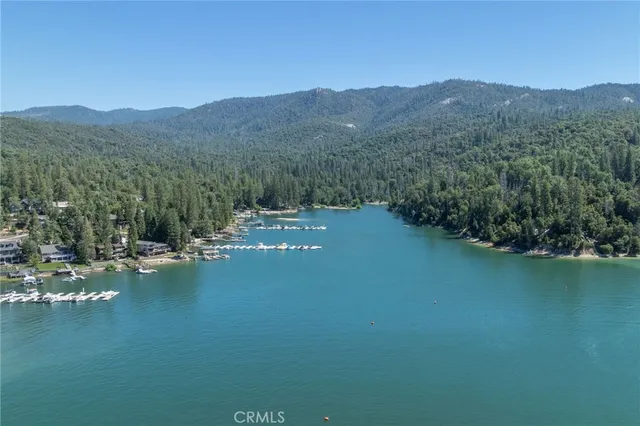 a view of a house with yard and sitting area