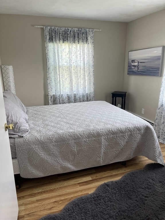 31 Haley Road, Unit A Marblehead, MA 01945 - Photo 13 of 18 a bedroom with a bed and window