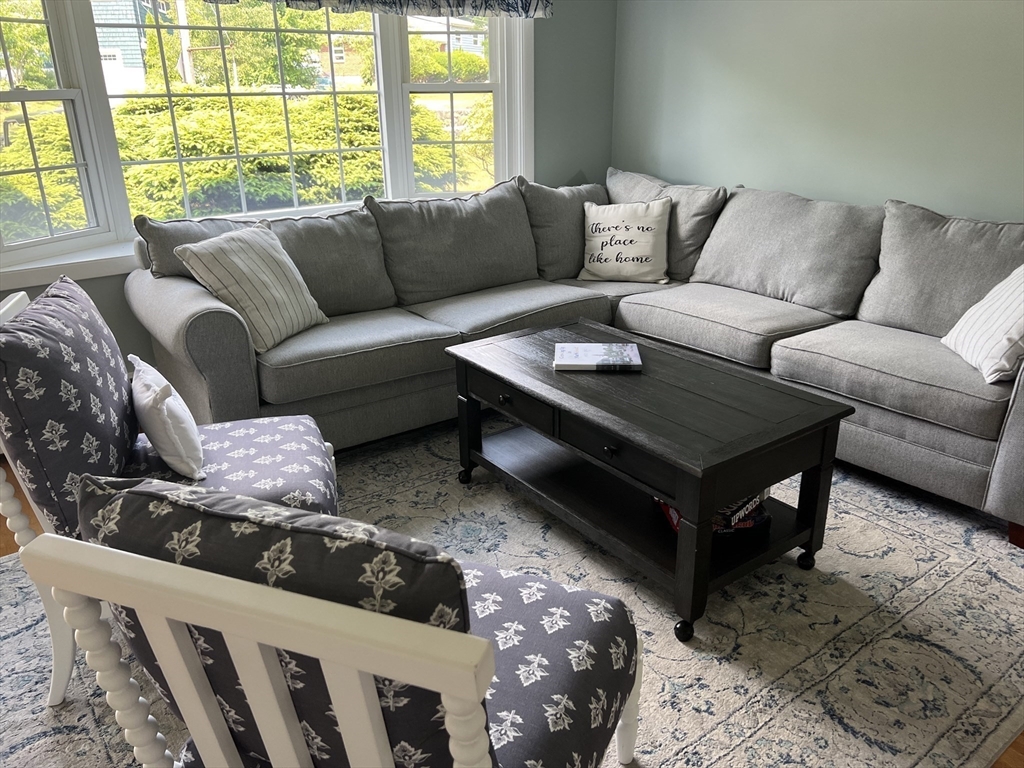 31 Haley Road, Unit A Marblehead, MA 01945 - Photo 4 of 18 a living room with furniture and a large window