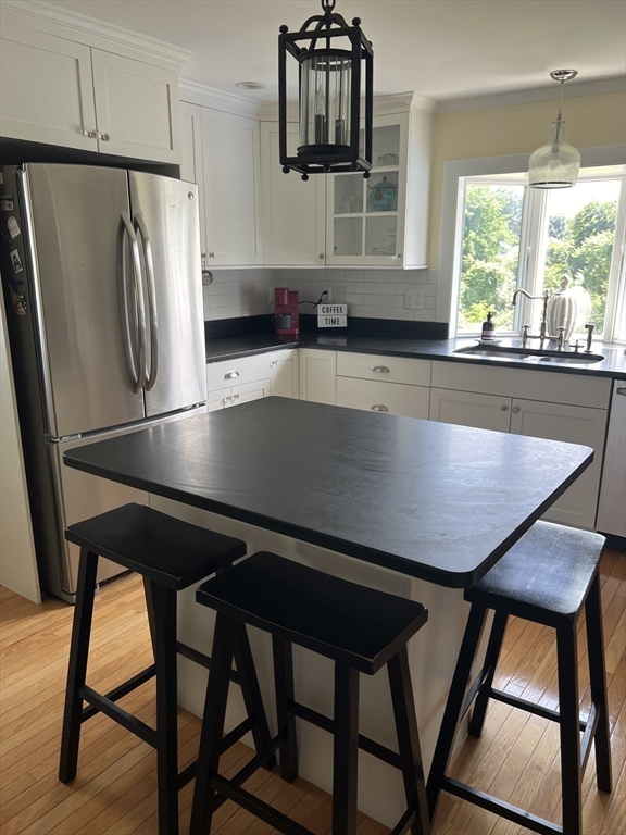 31 Haley Road, Unit A Marblehead, MA 01945 - Photo 7 of 18 a kitchen with a table chairs and window