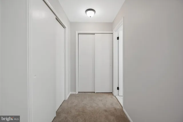 a bathroom with a sink a toilet and a window