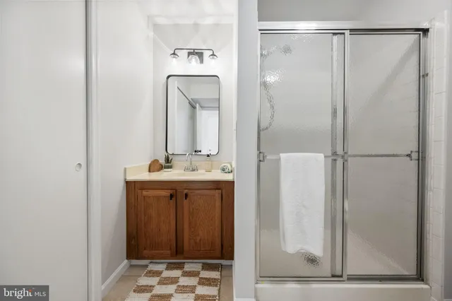 a bedroom with bed and a window