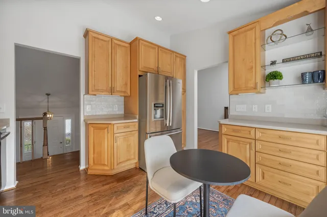 a kitchen with a stove a sink and a refrigerator