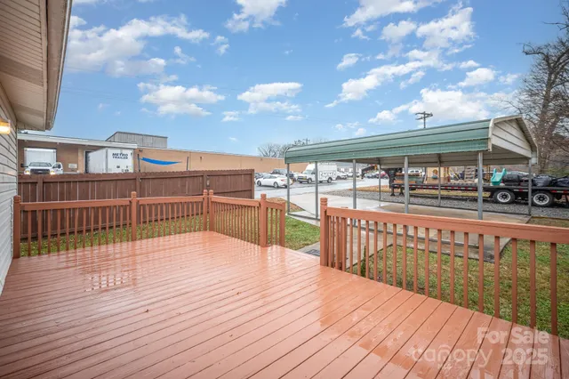 a view of a terrace with wooden floor and city view