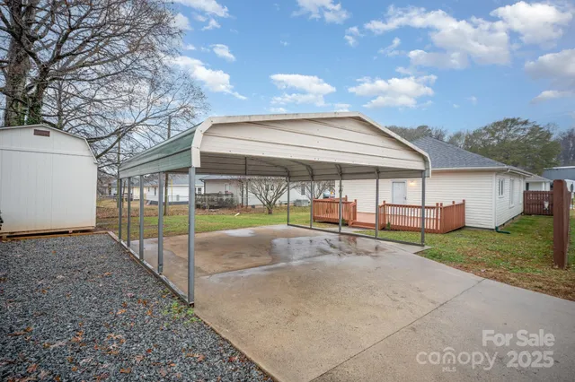 a view of a house with a yard and porch