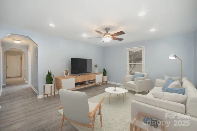 a living room with furniture and a flat screen tv