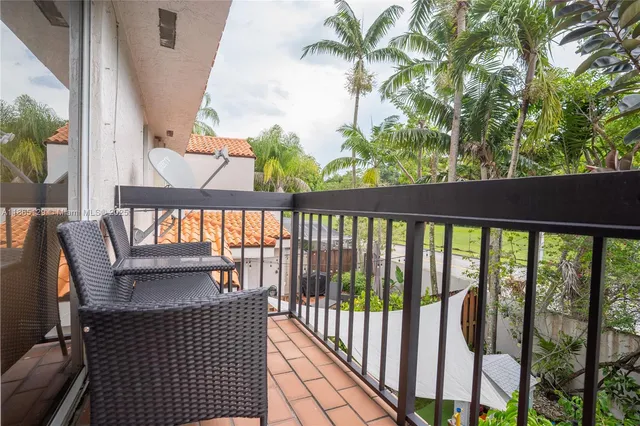 a view of balcony with furniture
