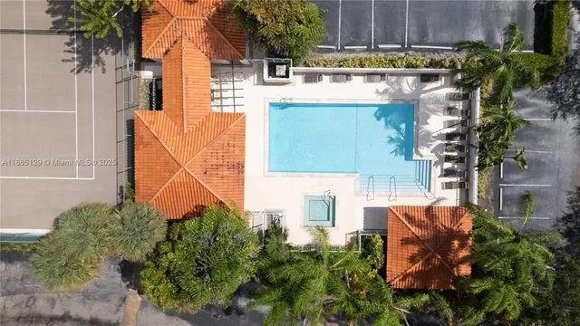 an aerial view of a house with a garden