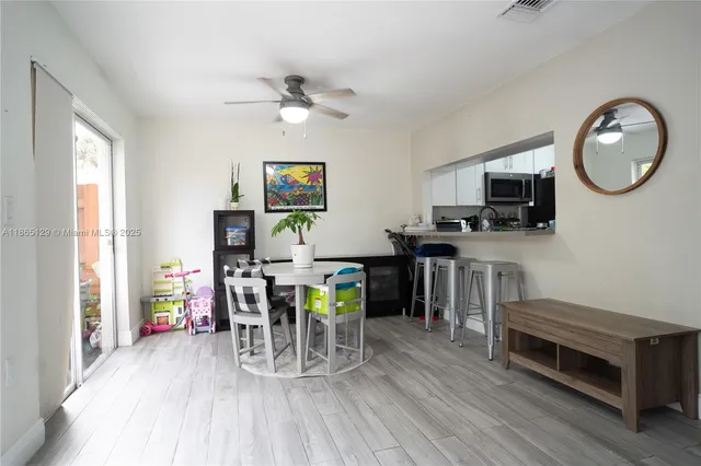 a view of kitchen and dining room with wooden floor