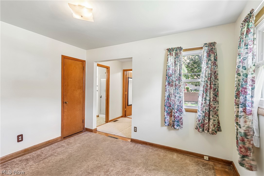 2758 Shellhart Road Norton, OH 44203 - Photo 15 of 41 Primary bedroom with closet, primary bathroom and carpet flooring