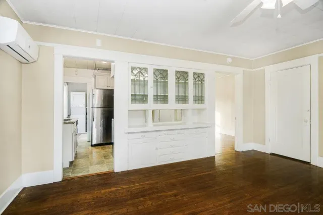 a kitchen with stainless steel appliances granite countertop a refrigerator a stove a sink and a microwave