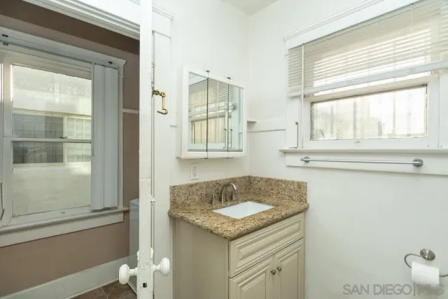 a bathroom with a glass shower door