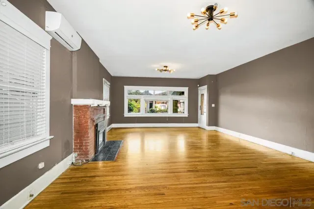 a kitchen with granite countertop a refrigerator and a stove top oven