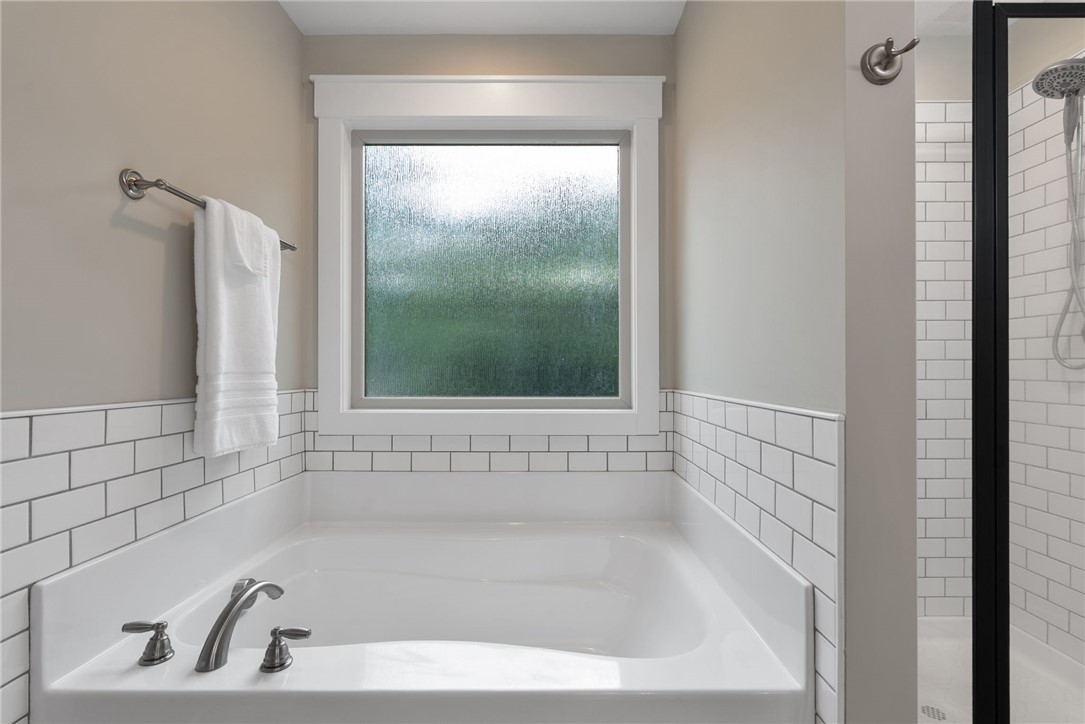 201 Hearthstone Drive Anderson, SC 29621 - Photo 31 of 49 A well-appointed bathroom features a deep soaking tub and a separate glass-enclosed shower.