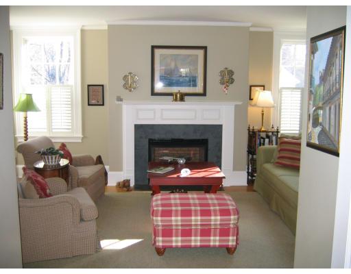 32 Pine Street Wellesley, MA 02481 - Photo 4 of 14 a living room with furniture a fireplace and a window
