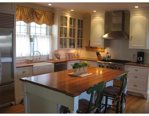 32 Pine Street Wellesley, MA 02481 - Photo 7 of 14 a kitchen with a dining table chairs and window