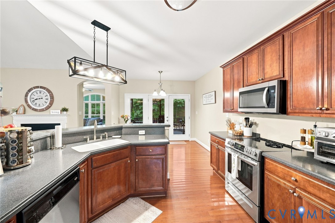 11318 River Road Chesterfield, VA 23838 - Photo 8 of 29 Hardwood flooring throughout, kitchen featuring wo
