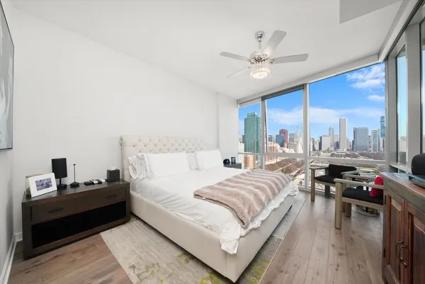 a view of a living room with a floor to ceiling window and an outdoor view
