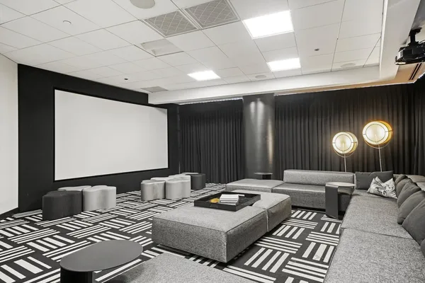 a room with lots of table and chairs