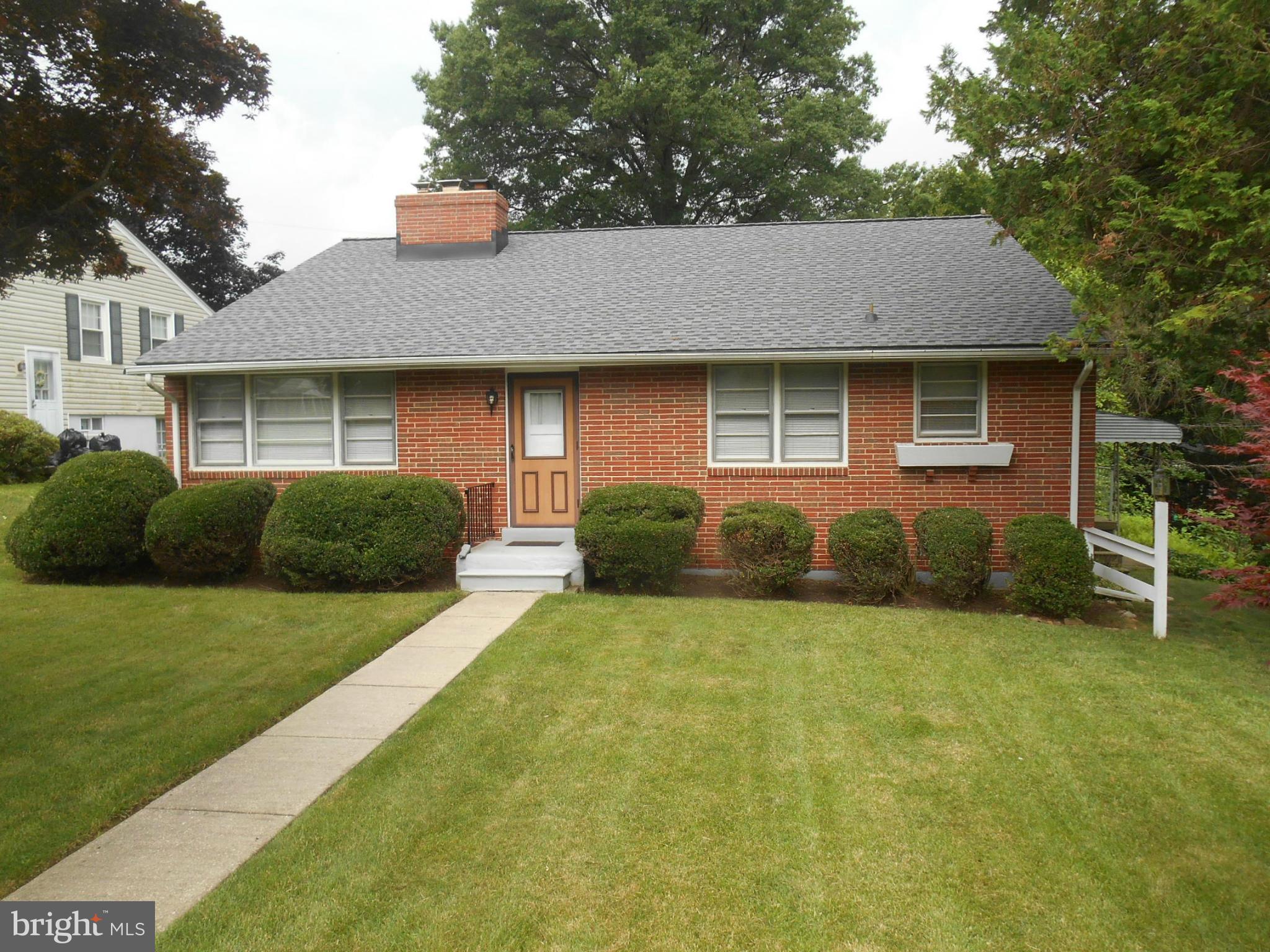 1414 Shefford Road Baltimore, MD 21239 - Photo 1 of 12 a view of a house with backyard and garden