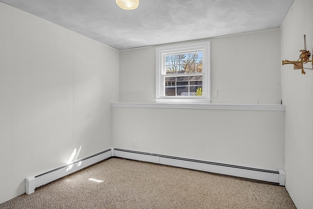 31 Hemlock Road Reading, MA 01867 - Photo 24 of 28 an empty room with a window