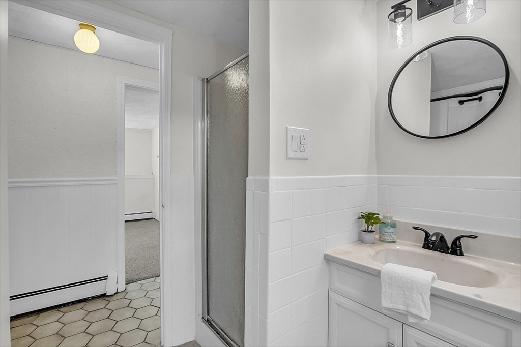 31 Hemlock Road Reading, MA 01867 - Photo 26 of 28 a bathroom with a sink and a mirror