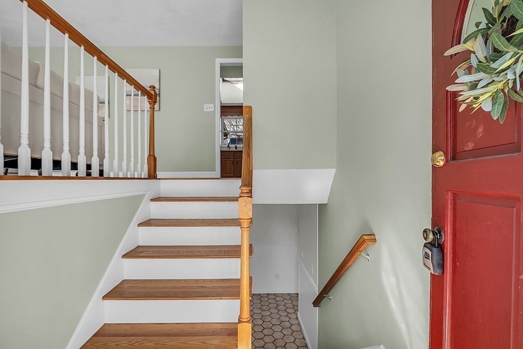 31 Hemlock Road Reading, MA 01867 - Photo 3 of 28 a view of staircase with white walls and a window