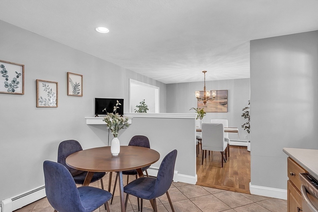 31 Hemlock Road Reading, MA 01867 - Photo 9 of 28 a view of a dining room with furniture and wooden floor