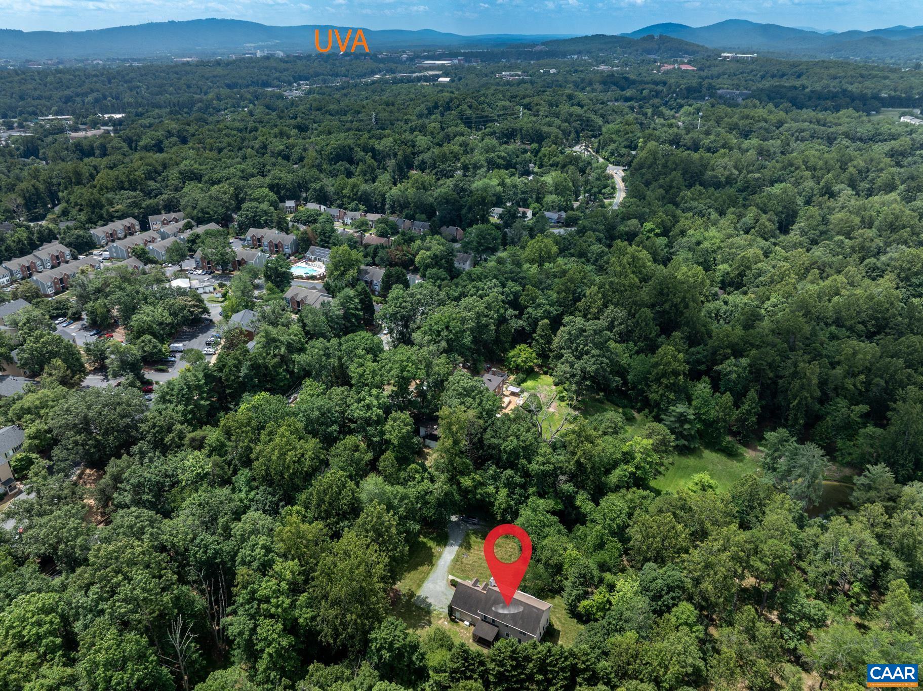 505 Georgetown Road Charlottesville, VA 22901 - Photo 17 of 73 an aerial view of a houses with a lush green hillside