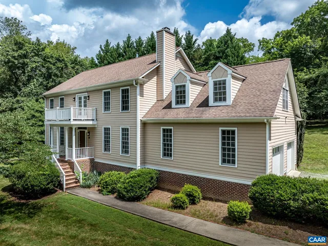 a aerial view of a house with a yard